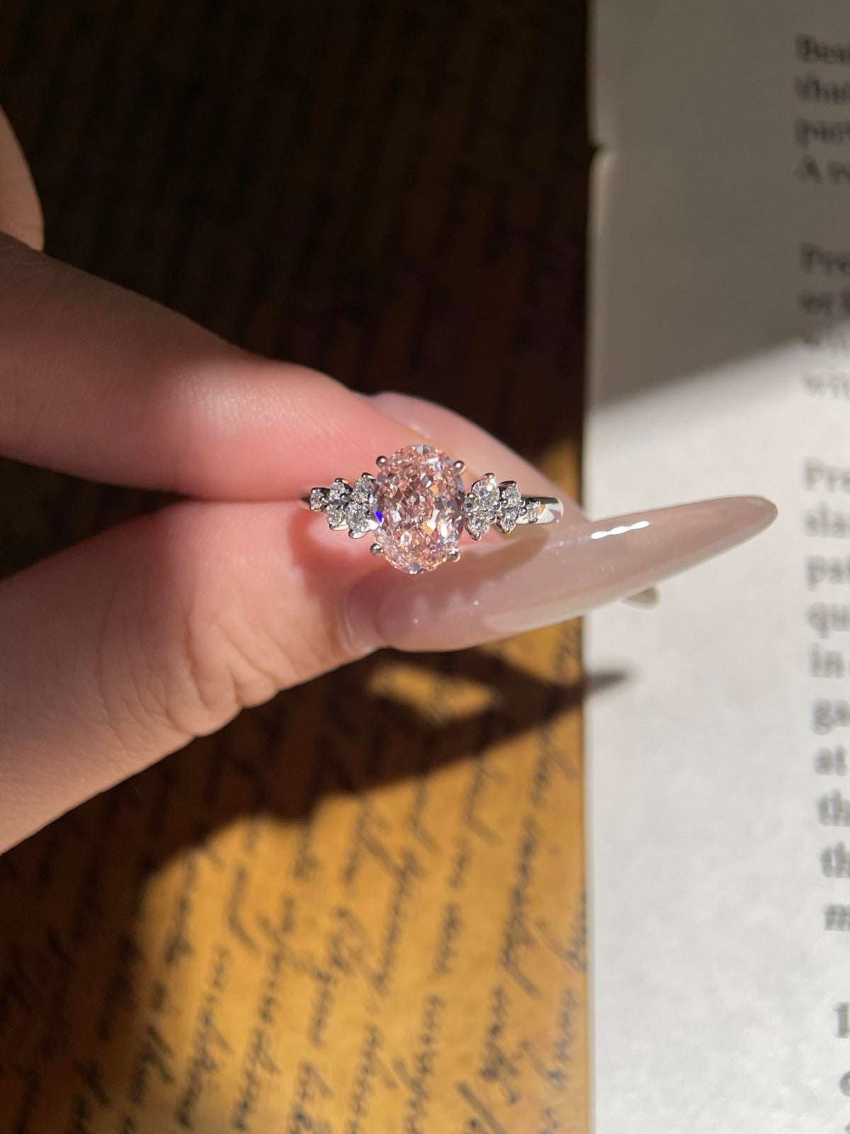 Oval Pink Moissanite Engagement Ring with Floral Side Stones