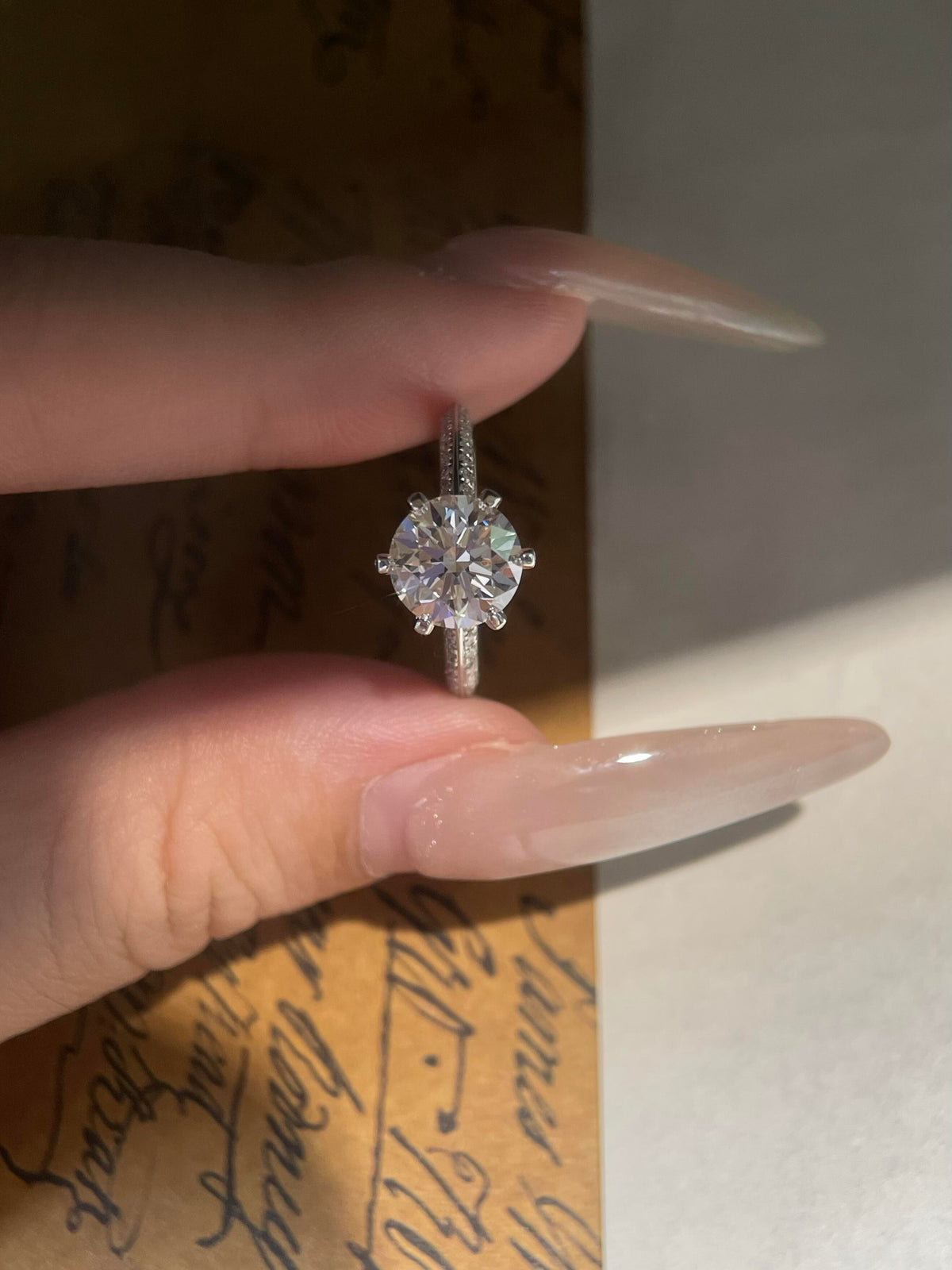Elegant Round Cut Diamond Engagement Ring with Pavé Diamond Band